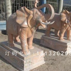 象鼻向上大象石雕,晚霞紅大象雕塑